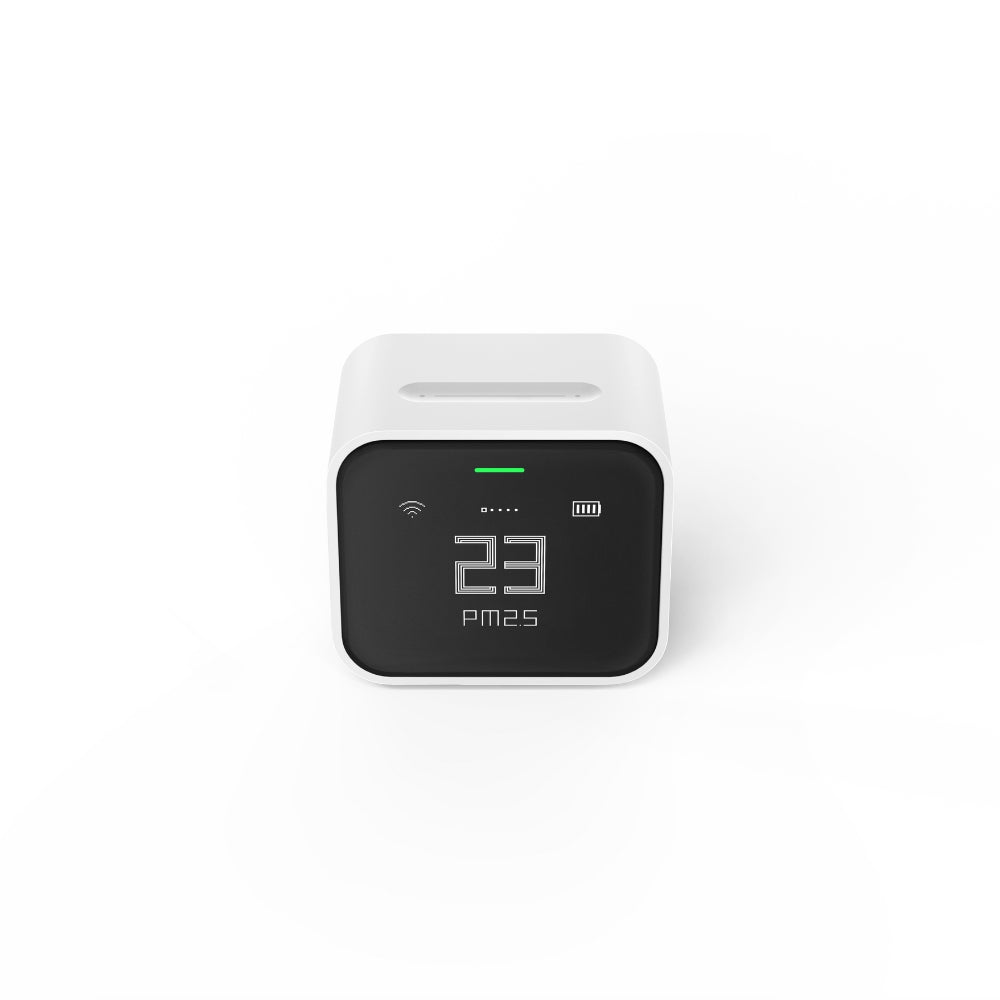 Air quality monitor with digital display on a white background